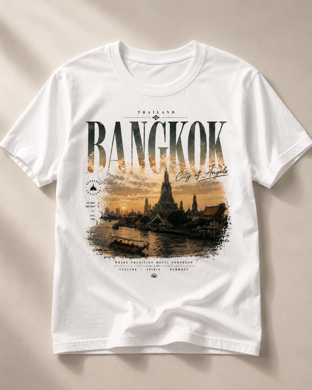 A white short-sleeve crewneck t-shirt featuring a detailed graphic print of Bangkok, Thailand, with the word &